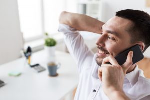 businessman calling on smartphone at office